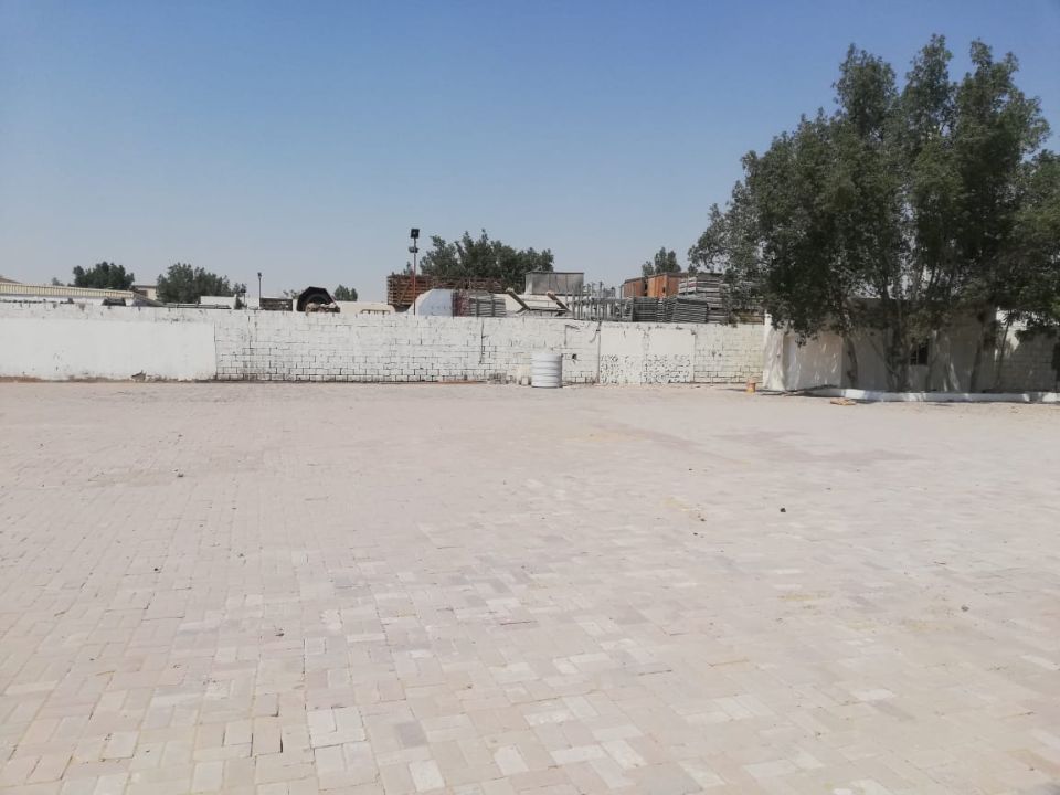 20,000 Sq Ft Industrial Land with Office & Fully Interlocked Boundary Wall for Rent in Sajja, Sharjah  | RGEstate UAE