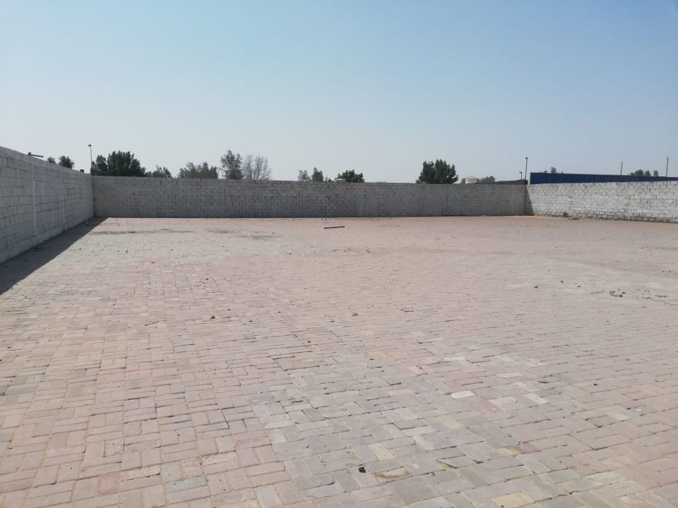 20,000 Sq Ft Industrial Land with Office & Fully Interlocked Boundary Wall for Rent in Sajja, Sharjah  | RGEstate UAE