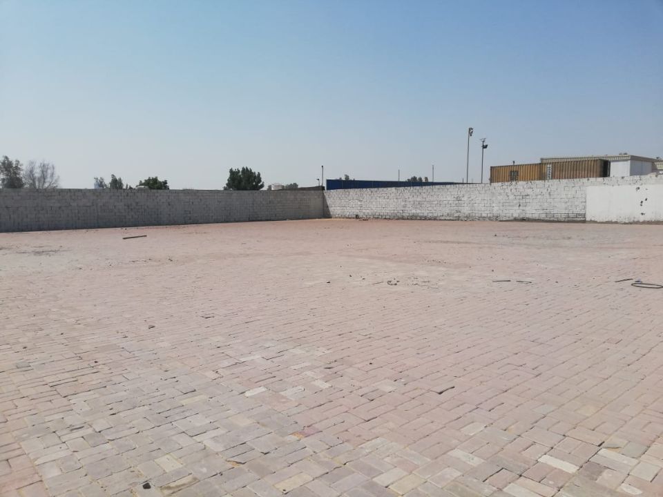 20,000 Sq Ft Industrial Land with Office & Fully Interlocked Boundary Wall for Rent in Sajja, Sharjah  | RGEstate UAE